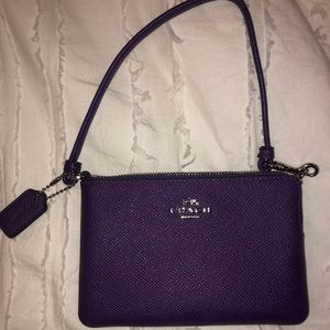 purple Coach wristlet